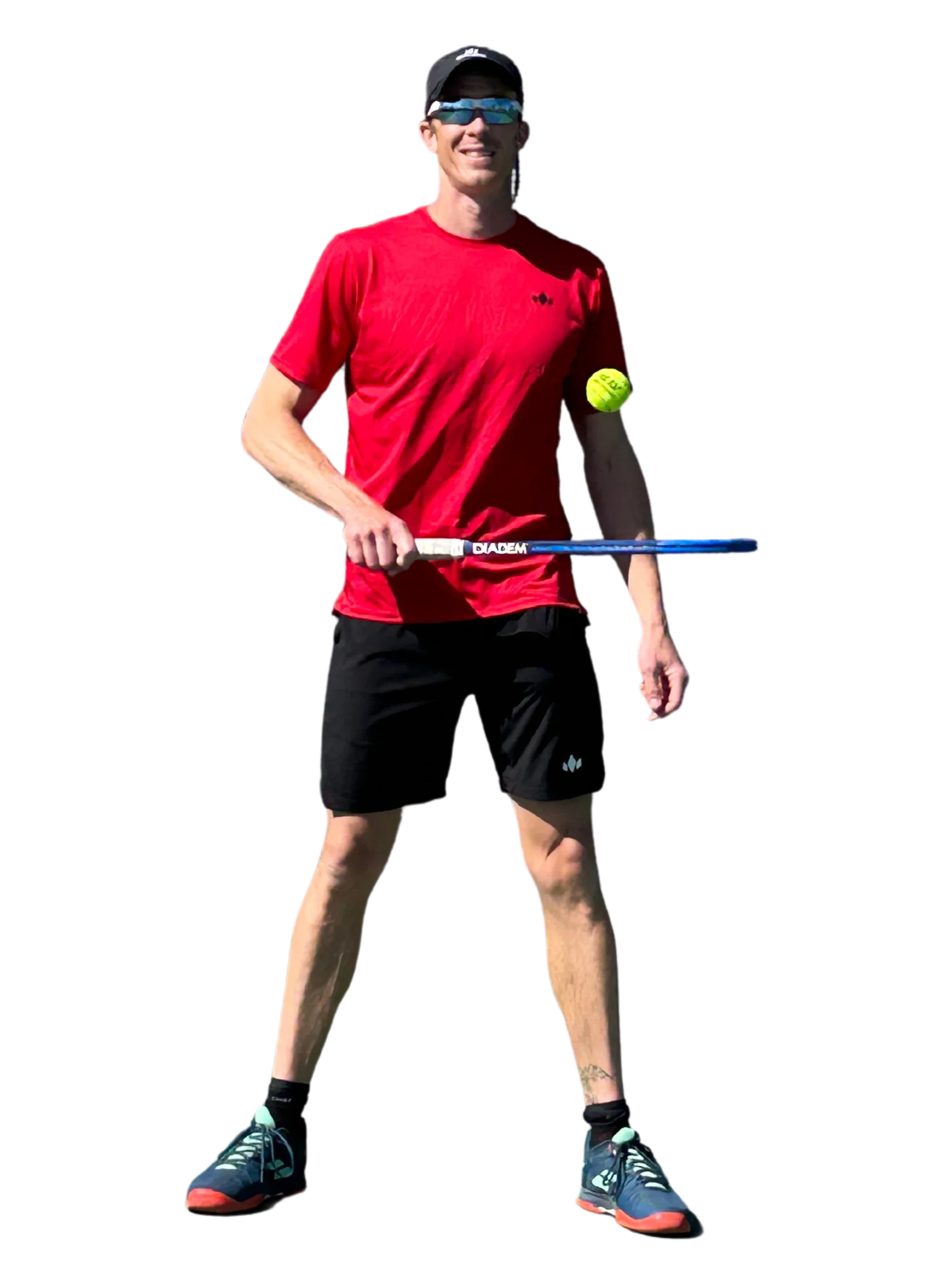 Ben Wolfe in red shirt and black shorts holding a tennis racket and ball on a white background